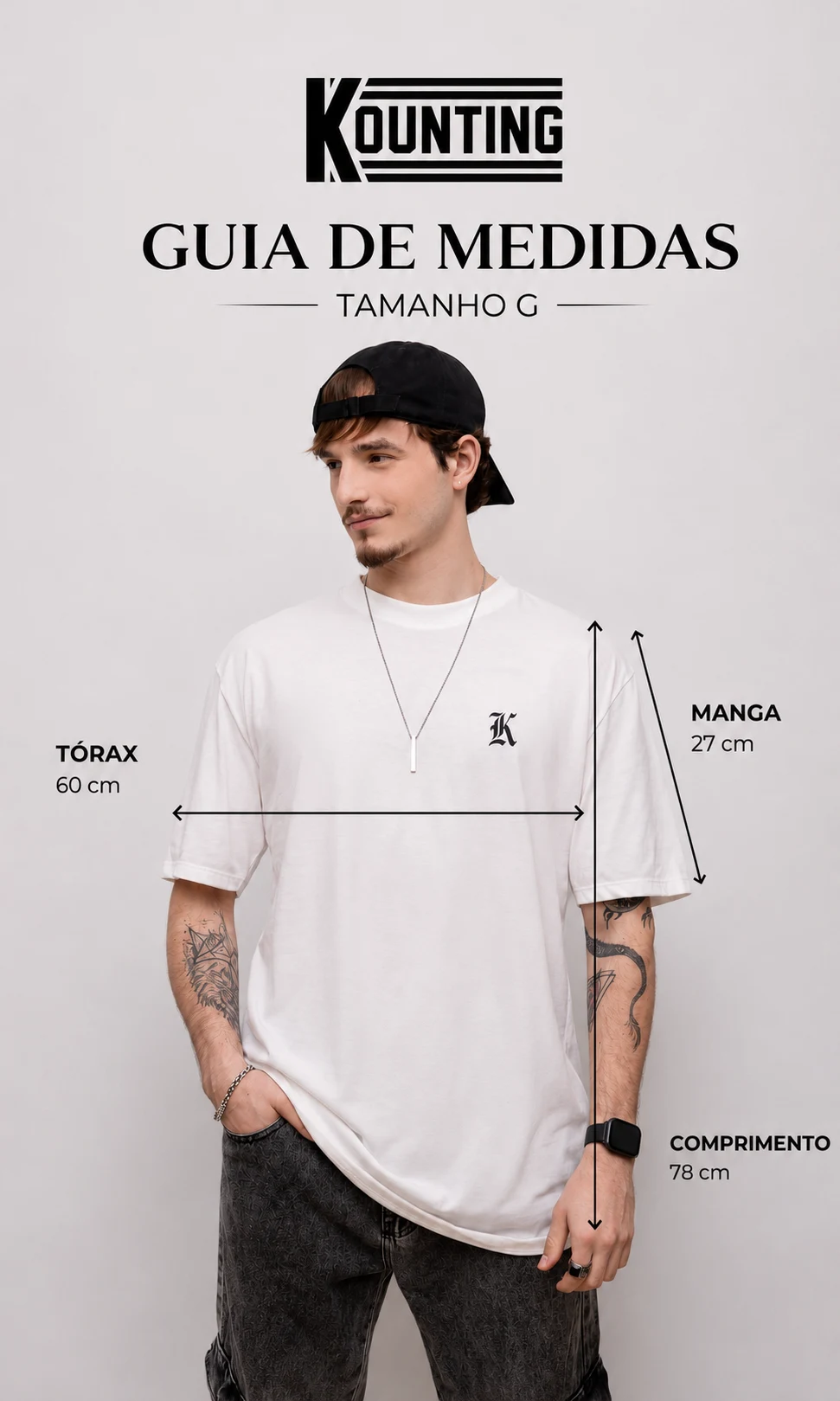 Guia de medidas oficial da linha Oversized Essential no tamanho G, com medidas de tórax, comprimento e manga